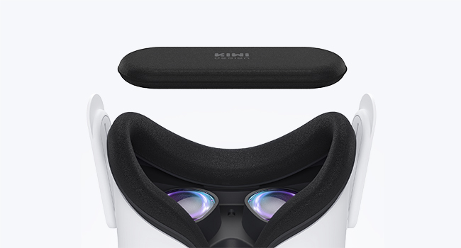 A virtual reality headset with a black remote control and two blue light-emitting areas on the front.